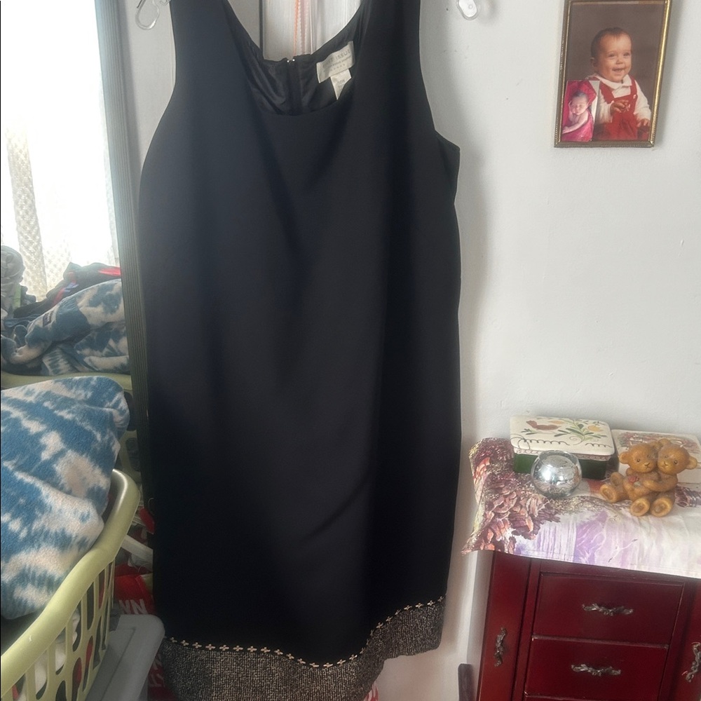 Elegant Black Dress with Embellished Hem